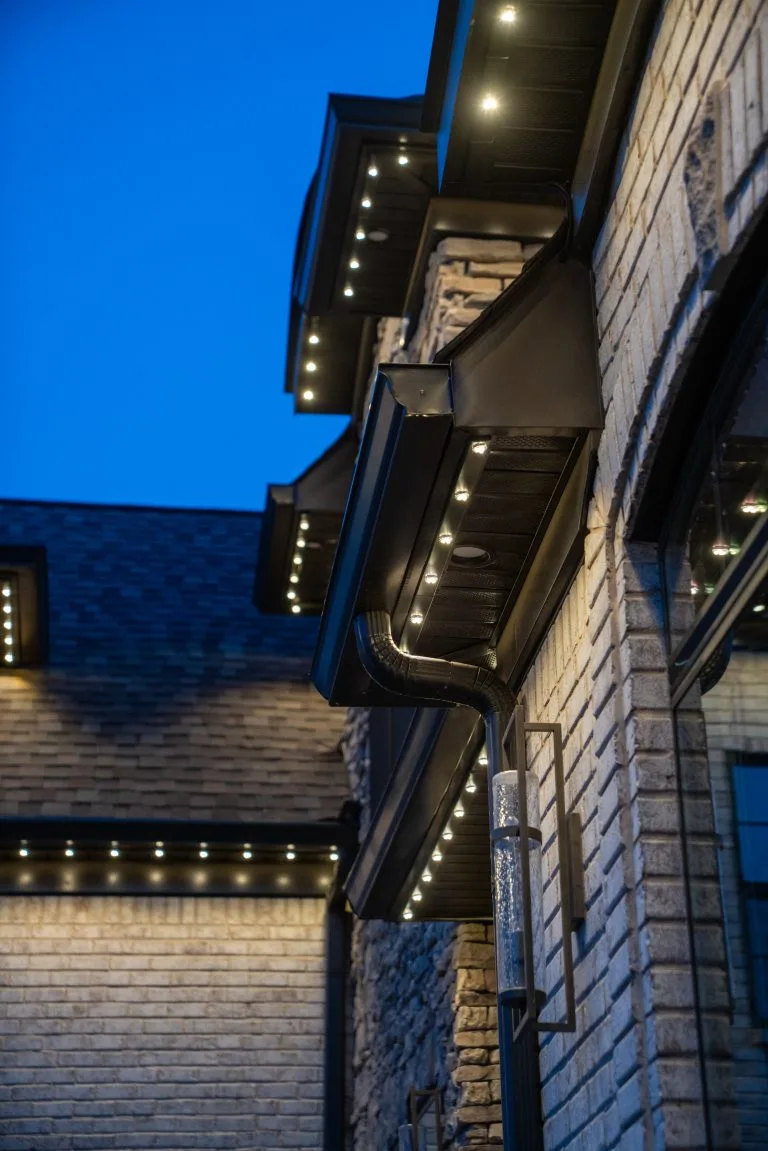 Warm lights illuminate the elegant architecture against a twilight sky