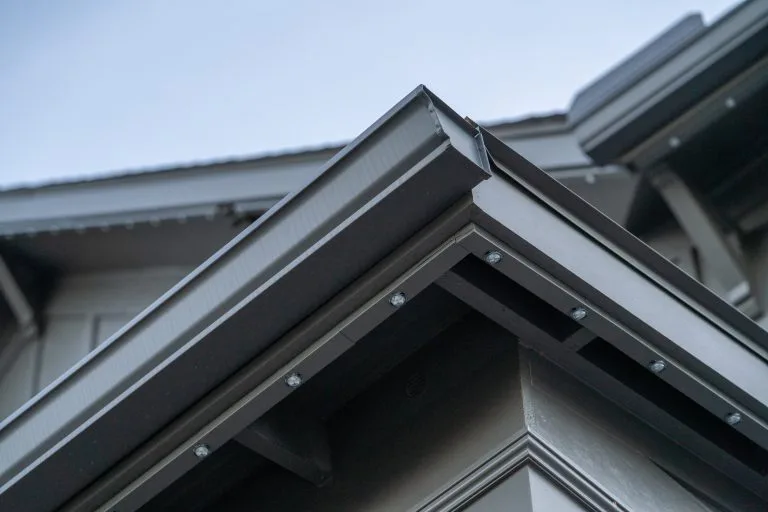 A close-up view captures the sharp edges of a modern roofline