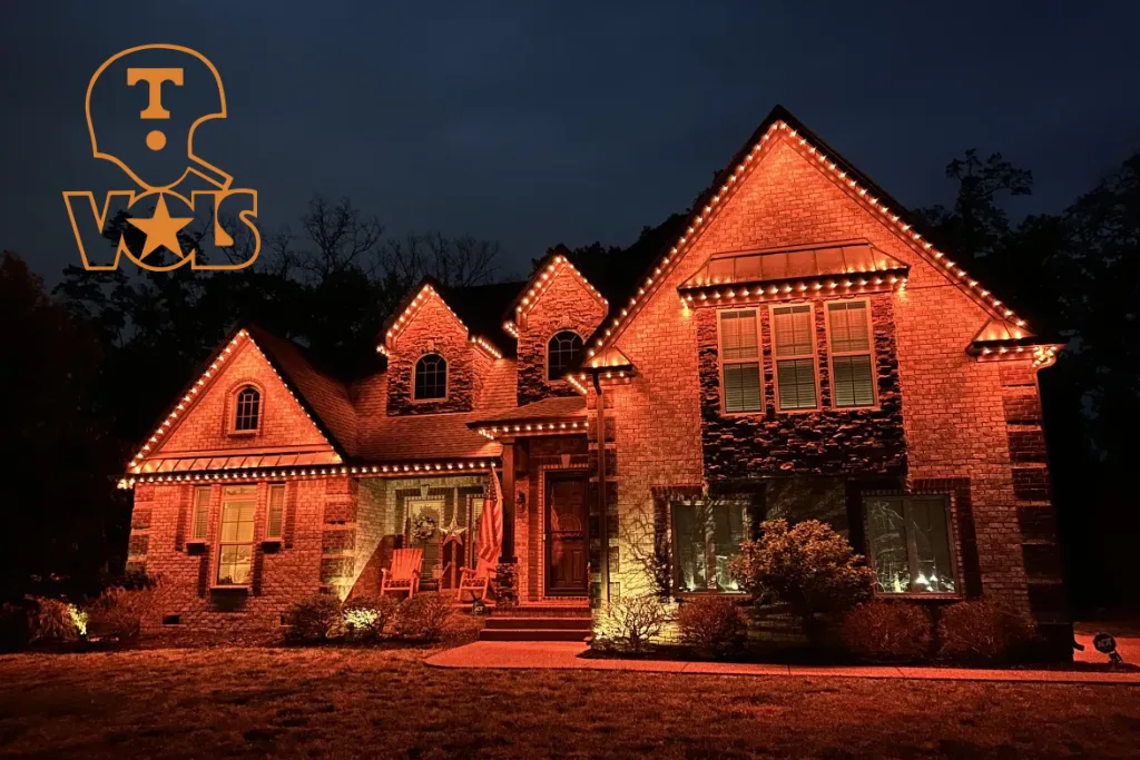A beautifully lit house glows warmly under a night sky